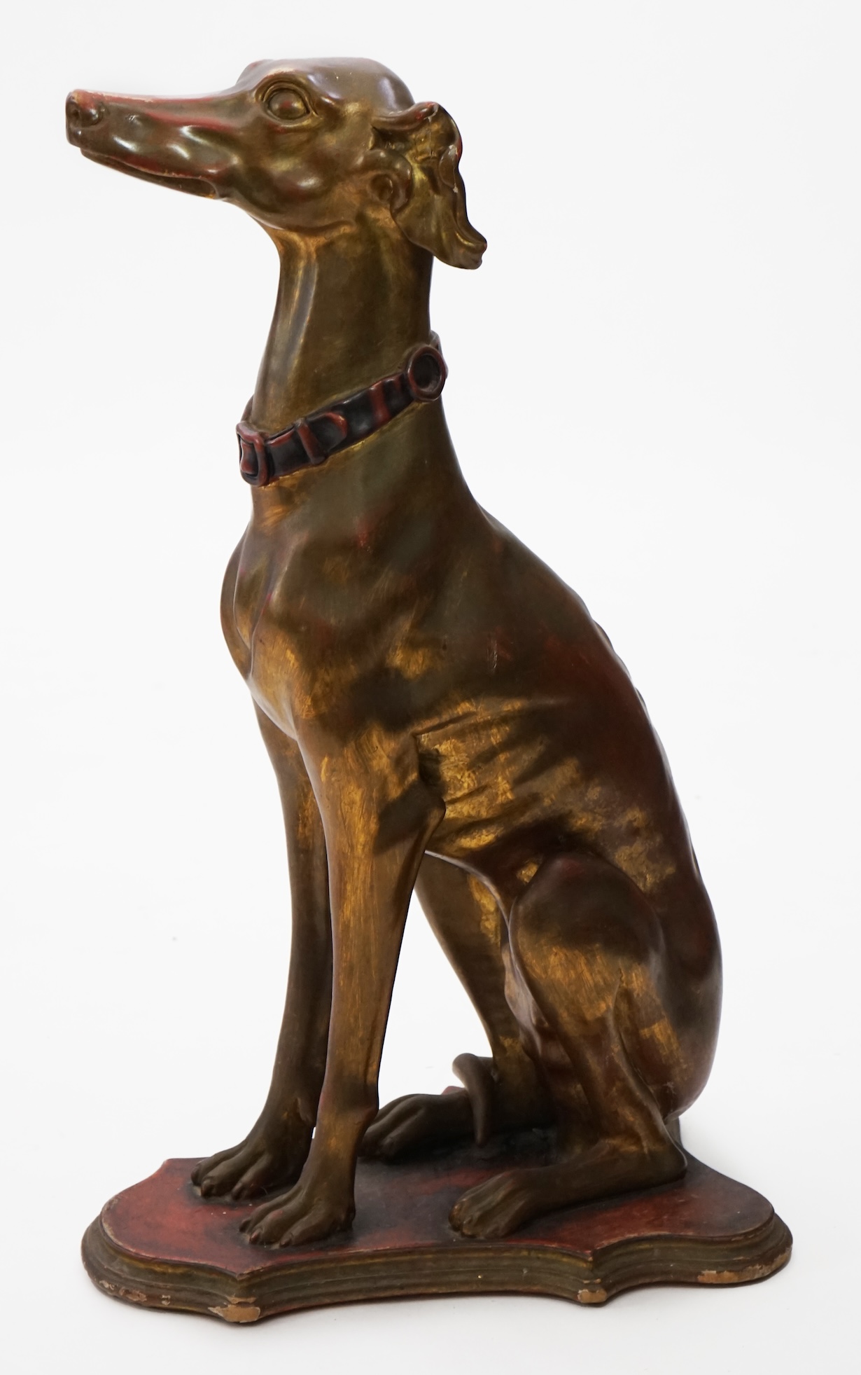 A 20th century Italian gilt and painted model of a seated Greyhound